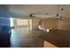 Spacious living room with hard wood floors, ceiling fan and bar top to kitchen at 4772 Dover Ne St, St Petersburg, FL 33703
