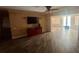Living room area with wood floors and open layout to kitchen area at 4772 Dover Ne St, St Petersburg, FL 33703