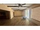 Open living area with hardwood floors, ceiling fans and sliding glass doors at 4772 Dover Ne St, St Petersburg, FL 33703