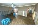 Spacious living room featuring hardwood floors, updated lighting, and ready for remodel at 4772 Dover Ne St, St Petersburg, FL 33703