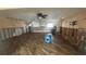 Spacious living room featuring hardwood floors, updated lighting, and ready for remodel at 4772 Dover Ne St, St Petersburg, FL 33703