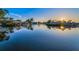 Scenic waterfront view with calm waters, lush greenery, and waterfront homes in a coastal neighborhood at 4772 Dover Ne St, St Petersburg, FL 33703