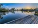 Scenic waterfront view with a private dock, calm water, and picturesque surroundings enhances the property's appeal at 4772 Dover Ne St, St Petersburg, FL 33703