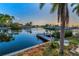 Enjoy waterfront living with a private dock and peaceful water views, surrounded by lush tropical landscaping at 4772 Dover Ne St, St Petersburg, FL 33703