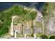 Birds eye view of the home showing the roof, driveway, and neighboring properties at 5058 Westlake Blvd, Dade City, FL 33523