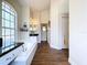 Bathroom showcasing a soaking tub, white cabinets, and dark countertops with a tile floor at 5058 Westlake Blvd, Dade City, FL 33523