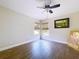 Inviting bedroom with wood-look flooring, ceiling fan, and natural light from the window at 5058 Westlake Blvd, Dade City, FL 33523