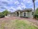 View of home showcasing manicured landscaping and architectural details at 5058 Westlake Blvd, Dade City, FL 33523