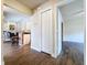 Spacious hallway with closet is open to the living room and features sleek flooring at 5058 Westlake Blvd, Dade City, FL 33523