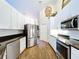 Spacious kitchen with stainless steel appliances, granite countertops, and white cabinets at 5058 Westlake Blvd, Dade City, FL 33523