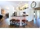 Charming kitchen featuring a brick-accented bar, granite counters, and stainless steel appliances at 5058 Westlake Blvd, Dade City, FL 33523