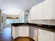 Functional kitchen with stainless steel dishwasher and granite countertops at 5058 Westlake Blvd, Dade City, FL 33523