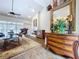 View of the living room with hardwood floors, fireplace, and elegant furniture at 5058 Westlake Blvd, Dade City, FL 33523