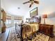 A spacious main bedroom showcases a large bed, detailed rug, and windows creating a luxurious retreat at 5058 Westlake Blvd, Dade City, FL 33523