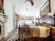 Main bedroom with a fireplace, wood floors, and slider doors to the screened in patio at 5058 Westlake Blvd, Dade City, FL 33523