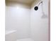 Shower showcasing white tiled walls, modern shower head and a bench at 5058 Westlake Blvd, Dade City, FL 33523