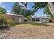 View of the home's backyard including the metal storage shed and covered patio area at 5826 20Th S Ave, Gulfport, FL 33707