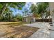 View of the property's backyard with metal storage shed, canopy, and concrete patio at 5826 20Th S Ave, Gulfport, FL 33707