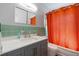 Updated bathroom features a modern vanity with a quartz countertop and vibrant accents at 5826 20Th S Ave, Gulfport, FL 33707