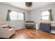 Bright Bedroom with hardwood floors, window and modern changing table at 5826 20Th S Ave, Gulfport, FL 33707