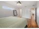 Bright bedroom with hardwood floors, closet and overhead ceiling fan at 5826 20Th S Ave, Gulfport, FL 33707