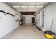 Bright garage interior with workbench, shelving, and a door to the outside at 5826 20Th S Ave, Gulfport, FL 33707