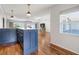 Bright living room features gorgeous hardwood floors, an island with bar seating and natural light at 5826 20Th S Ave, Gulfport, FL 33707