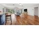 Cozy living room with hardwood floors, bar and sliding glass doors leading to the backyard at 5826 20Th S Ave, Gulfport, FL 33707
