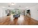 Bright living room with hardwood floors, sliding glass doors, and contemporary furnishings at 5826 20Th S Ave, Gulfport, FL 33707