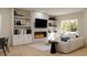 Cozy living room features custom built-in shelving, contemporary fireplace, and large window for natural light at 6 Simonton Ave, North Port, FL 34286