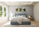 Serene bedroom features a tray ceiling, neutral decor, and large window for ample natural light at 6 Simonton Ave, North Port, FL 34286