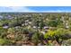 Aerial view of neighborhood featuring lush trees and several cozy homes at 601 Newton S Ave, St Petersburg, FL 33701