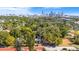 Real estate featuring a home nestled among trees, with a city skyline in the distance at 601 Newton S Ave, St Petersburg, FL 33701