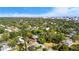 Aerial view displays a neighborhood with tree-lined streets and a distant cityscape, connecting residential living with urban accessibility at 601 Newton S Ave, St Petersburg, FL 33701