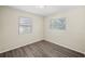Comfortable bedroom featuring modern flooring and two bright windows at 601 Newton S Ave, St Petersburg, FL 33701