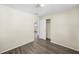Light-filled bedroom with wood-look floors and a closet at 601 Newton S Ave, St Petersburg, FL 33701