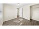 Bedroom featuring wood-look floors, closet and connecting door at 601 Newton S Ave, St Petersburg, FL 33701