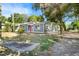 A charming single-story home with a well-maintained lawn and mature trees at 601 Newton S Ave, St Petersburg, FL 33701