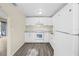 Kitchen features bright lighting, white cabinetry, and modern appliances at 601 Newton S Ave, St Petersburg, FL 33701