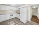 Kitchen featuring white appliances, cabinets, and neutral countertops at 601 Newton S Ave, St Petersburg, FL 33701