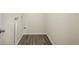 Laundry room with modern wood-look flooring and hookups at 601 Newton S Ave, St Petersburg, FL 33701