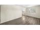 Bright living room with two windows and wood-look floors at 601 Newton S Ave, St Petersburg, FL 33701