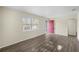 Comfortable living area featuring modern wood-look flooring and a bright window at 601 Newton S Ave, St Petersburg, FL 33701