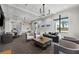 Bright and inviting lounge area featuring a mix of seating options and stylish decor at 6017 Silver Grass Ct, Nokomis, FL 34275