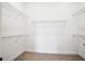 Clean, bright walk-in closet with sturdy shelving for ample storage at 6017 Silver Grass Ct, Nokomis, FL 34275