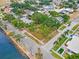 Waterfront land showcasing its prime location with surrounding mature trees and neighborhood homes at 602 & 604 Channel Dr, Tampa, FL 33606