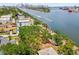 Waterfront land with mature trees, featuring views of the bay and nearby city skyline at 602 & 604 Channel Dr, Tampa, FL 33606