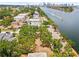 Waterfront land with mature trees, offering picturesque views and access to waterways and city skyline at 602 & 604 Channel Dr, Tampa, FL 33606
