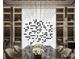 Dining area with modern art wine display and modern chandelier lighting at 602 & 604 Channel Dr, Tampa, FL 33606