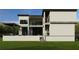 A modern two-story home with a neutral color scheme, large windows, and a covered outdoor space at 602 & 604 Channel Dr, Tampa, FL 33606